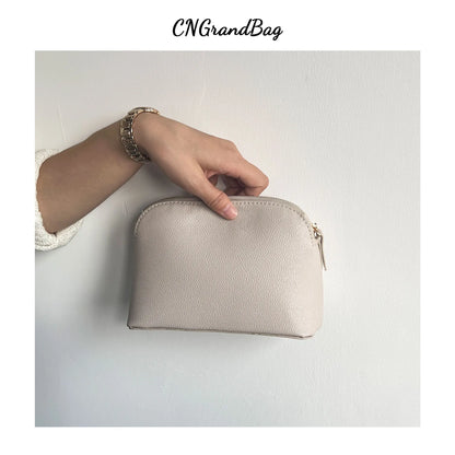 Bolsa de cosméticos de cuero sintético con letras personalizadas, clásica, sencilla, de color liso, con cremallera avanzada.