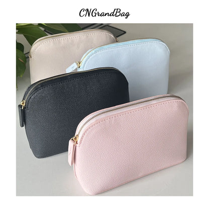 Bolsa de cosméticos de cuero sintético con letras personalizadas, clásica, sencilla, de color liso, con cremallera avanzada.