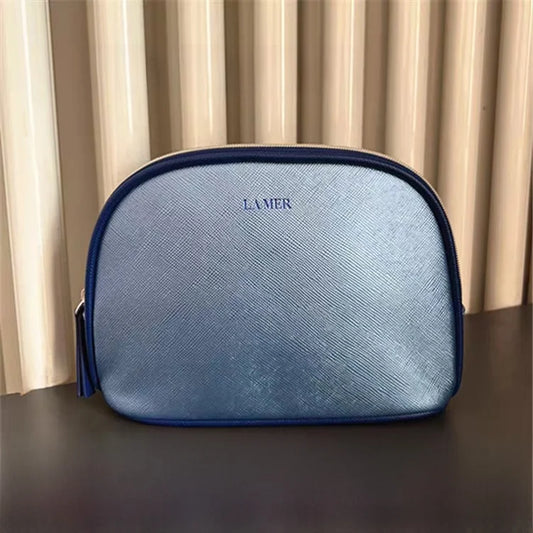 Bolsa de viaje portátil azul marino, una bolsa de mano de material PU de color puro, bolsa de almacenamiento fácil de llevar para artículos personales