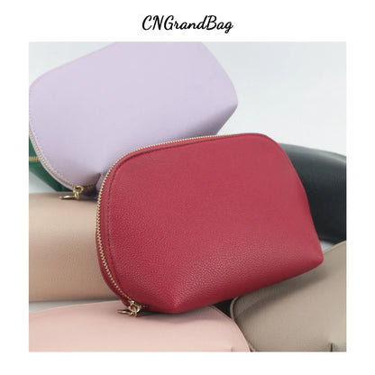 Bolsa de cosméticos de cuero sintético con letras personalizadas, clásica, sencilla, de color liso, con cremallera avanzada.