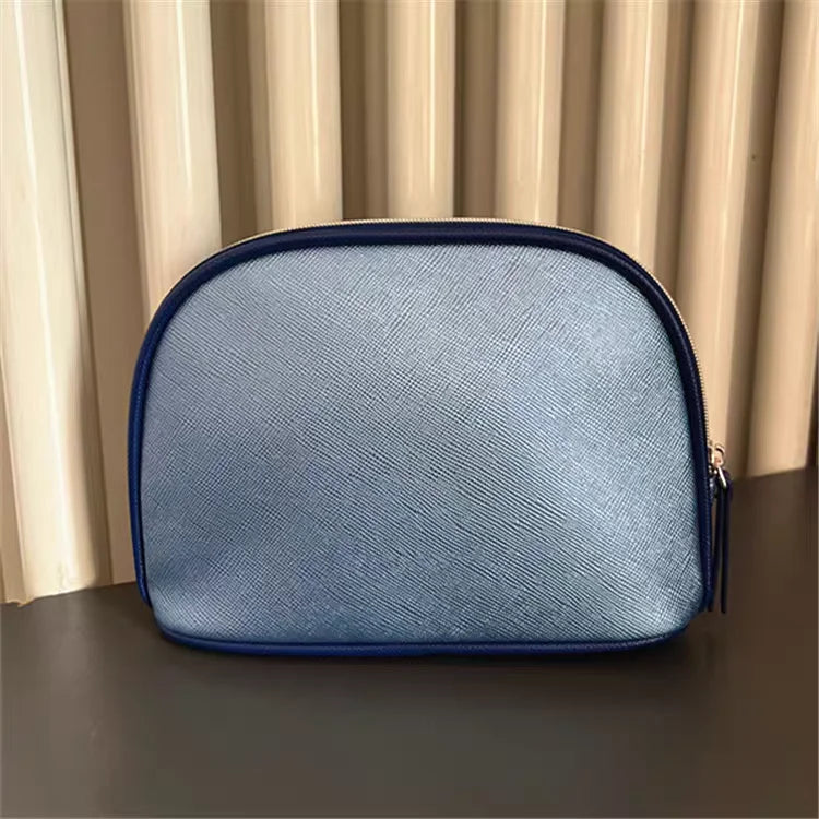 Bolsa de viaje portátil azul marino, una bolsa de mano de material PU de color puro, bolsa de almacenamiento fácil de llevar para artículos personales