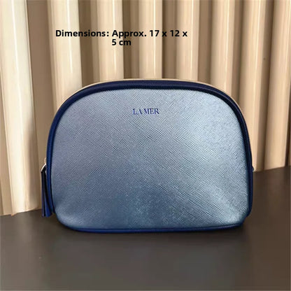 Bolsa de viaje portátil azul marino, una bolsa de mano de material PU de color puro, bolsa de almacenamiento fácil de llevar para artículos personales