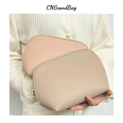 Bolsa de cosméticos de cuero sintético con letras personalizadas, clásica, sencilla, de color liso, con cremallera avanzada.